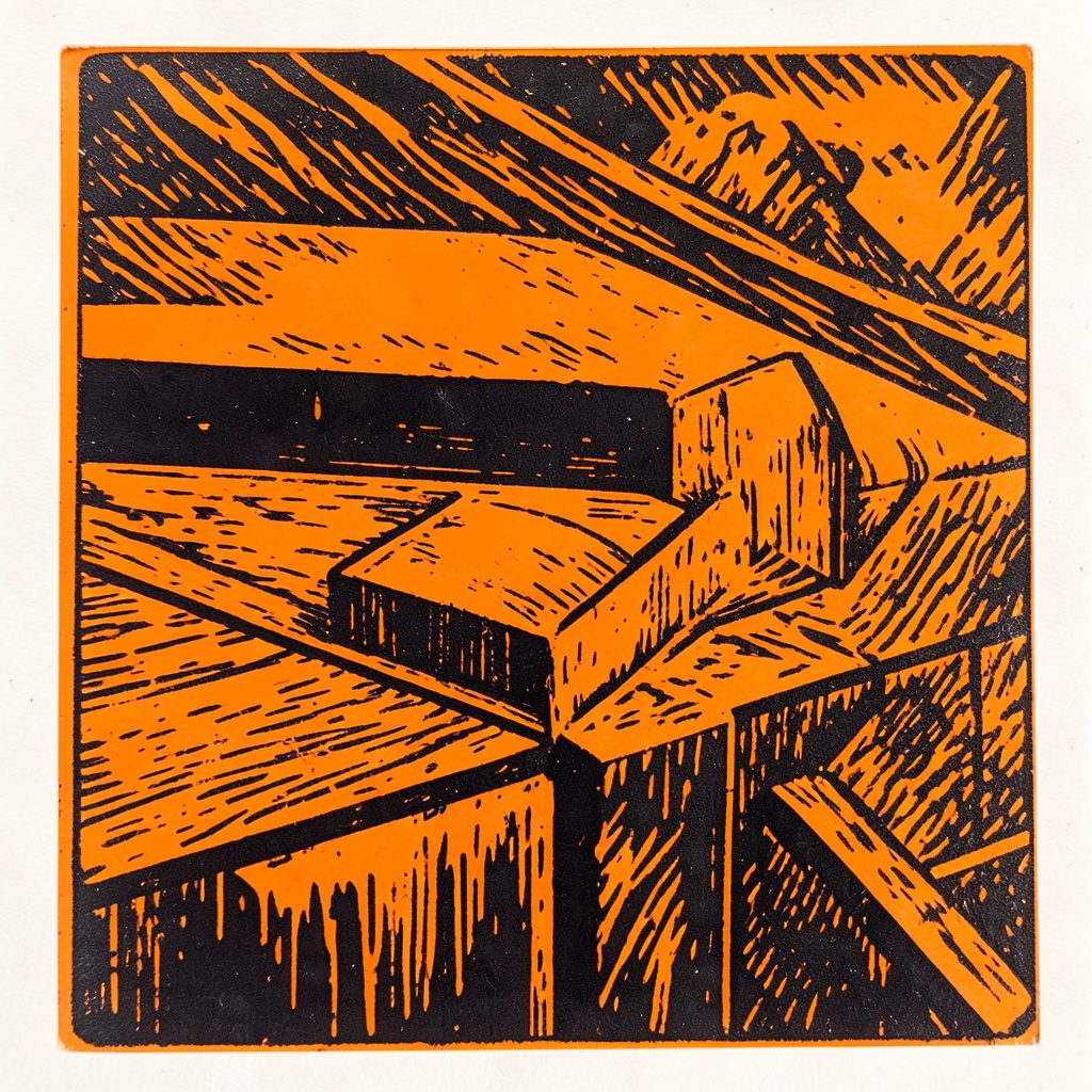 Carved linocut relief print of a decorative bottom border pattern, terracotta and cream